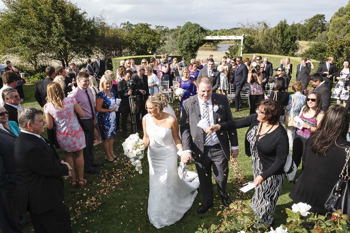 Bride and groom coming down aisle